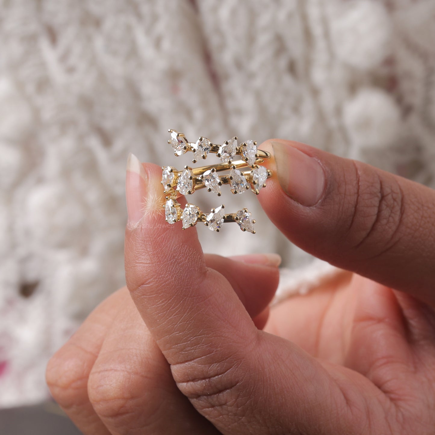 Pear Cut Moissanite Spiral Wrap Ring with Scattered Cluster Design