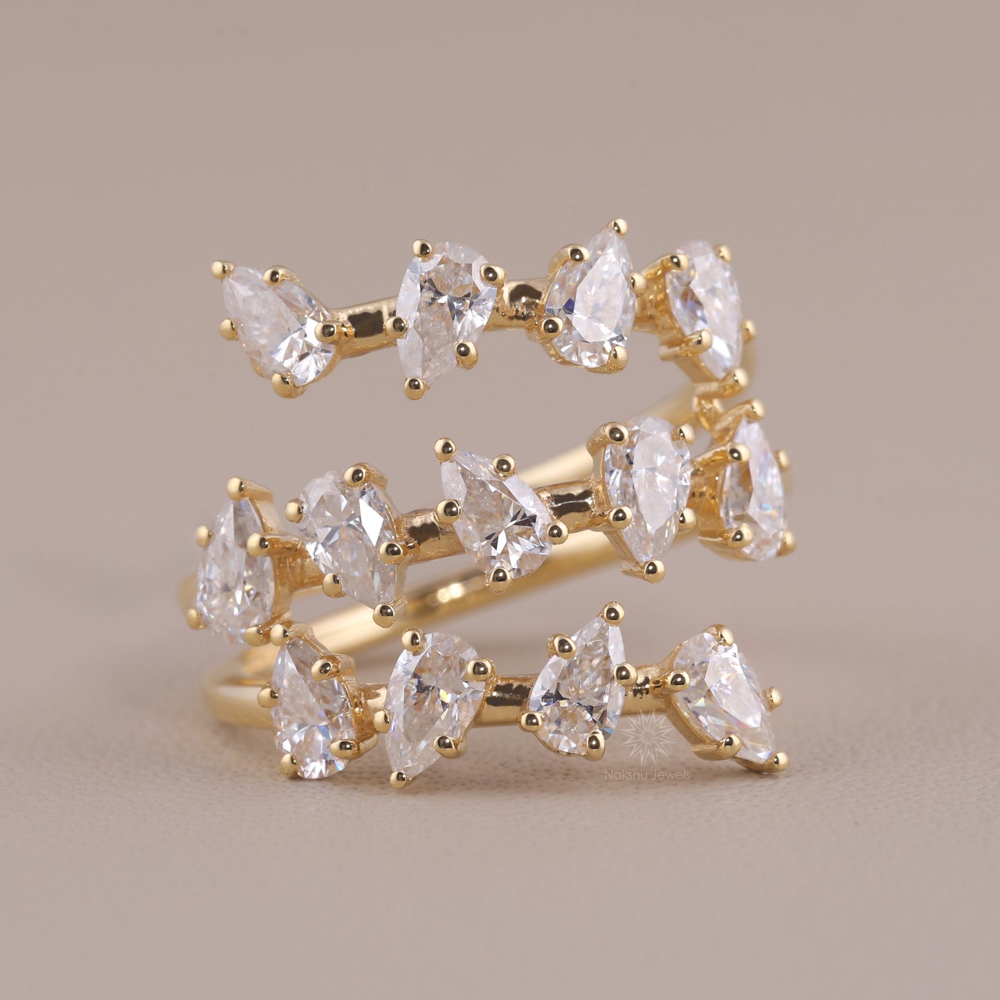 Pear Cut Moissanite Spiral Wrap Ring with Scattered Cluster Design