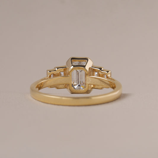 Emerald Cut Moissanite Five-Stone Bezel Ring with Graduated Baguette Side Stones